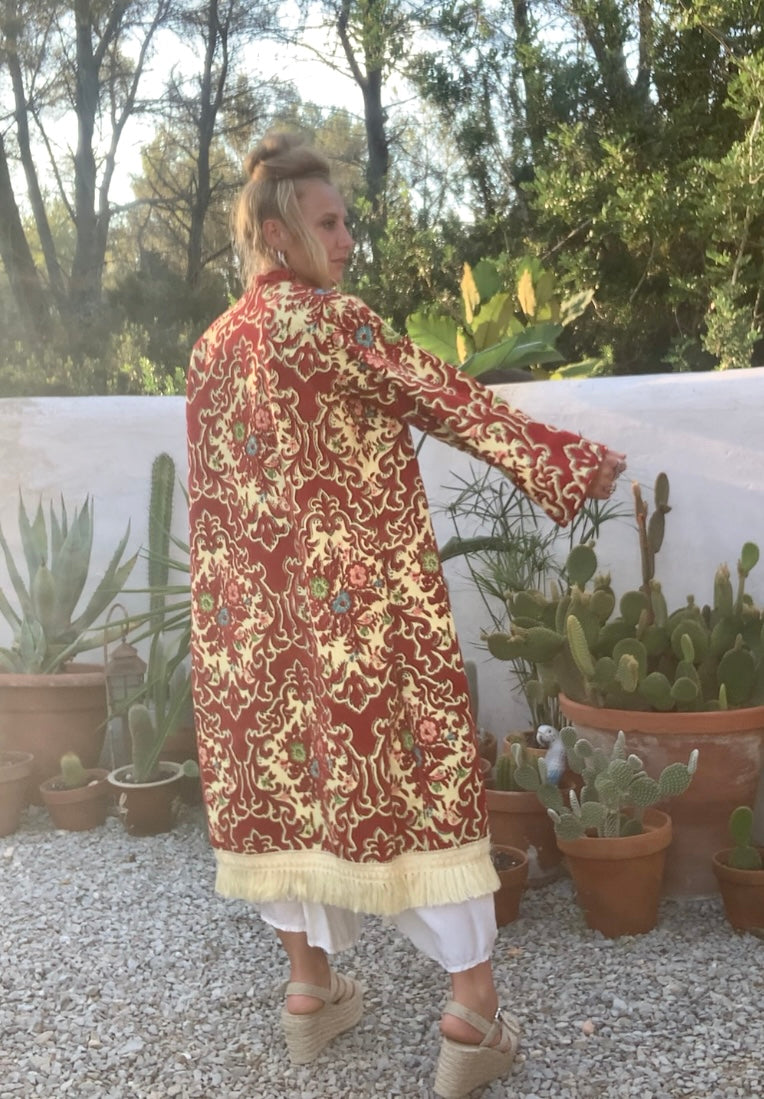 Vintage red and pastel yellow textiles with a burnet out devore Damascus pattern on the velvets pile very special textiles with tassel trim
