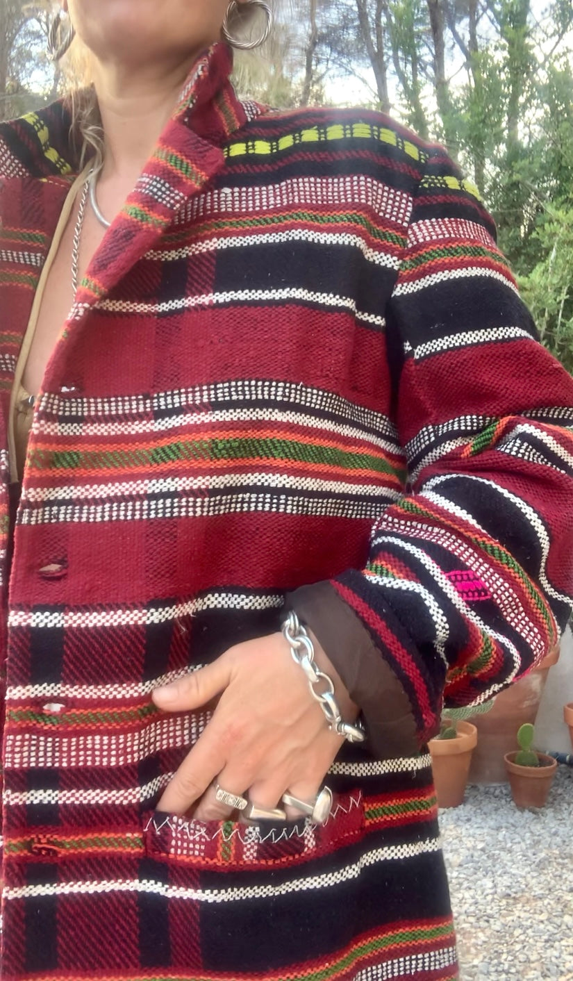 Original vintage woven Moroccan blanket jacket with red and black stripped design pockets and buttons up the front lined with black cotton